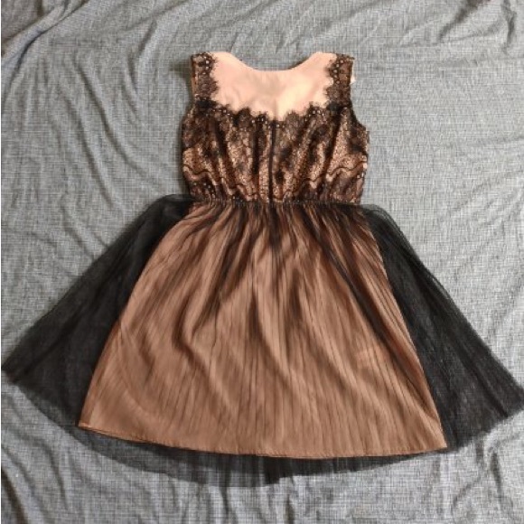 Medium never worn mid length dress, with a creamy under colour and sheer black - Picture 1 of 1